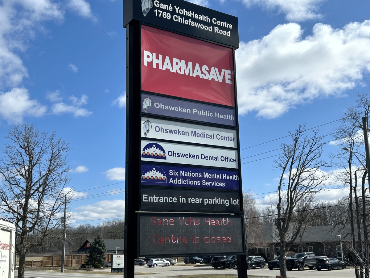 Picture of Gane Yohs Centre Sign that shows the various Well-being services available that are closed or relocated to the Whitepines Wellness Centre. Pharmasave and Mental Services are not affected by Mold Remediation